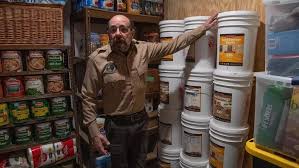 Fortitude Ranch Chief Operating Officer Steve Rene shows a storage room stacked with food in Mathias (AFP photo)